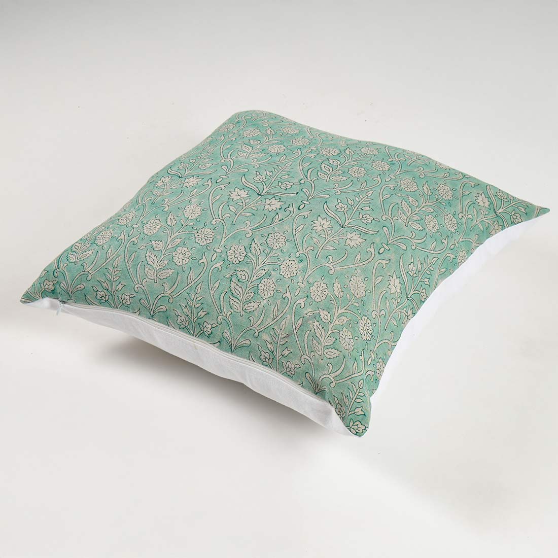 Decorative pillow with floral pattern on a white background
