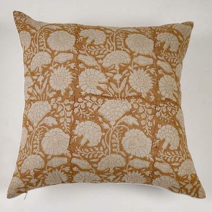 Decorative pillow with floral pattern on a yellow background