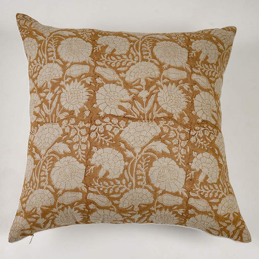 Decorative pillow with floral pattern on a yellow background