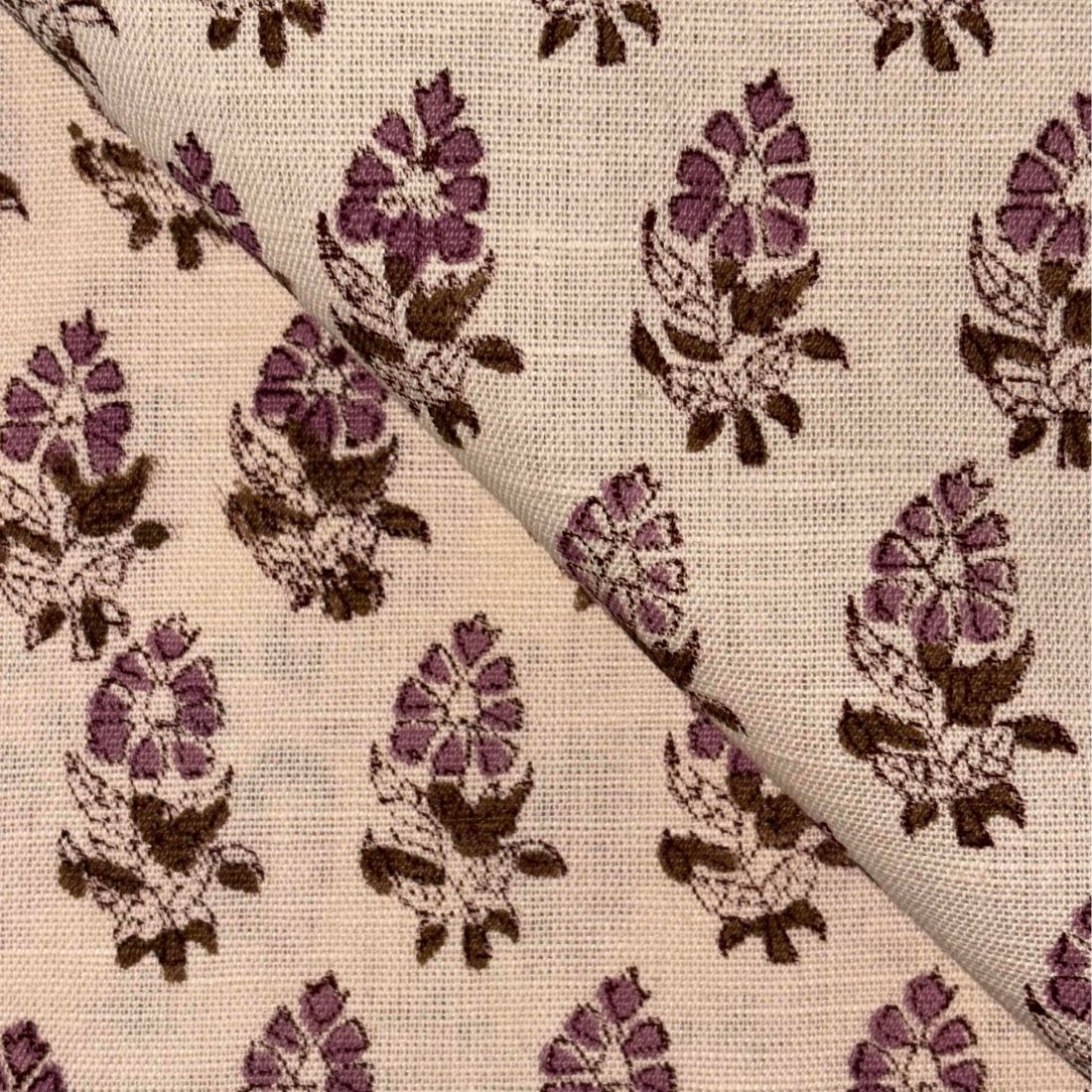 Fabric with pink and brown floral pattern on a beige background