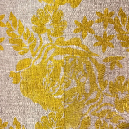 Yellow floral pattern on yellow fabric