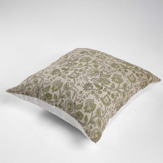 Decorative pillow with green floral pattern on a white background