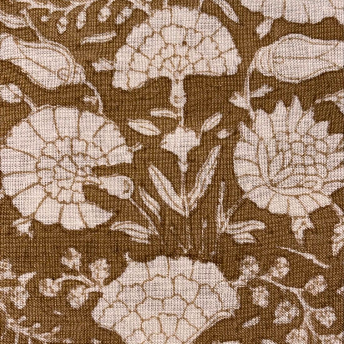 Floral pattern with beige flowers on a brown background