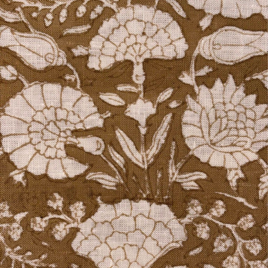 Floral pattern with beige flowers on a brown background