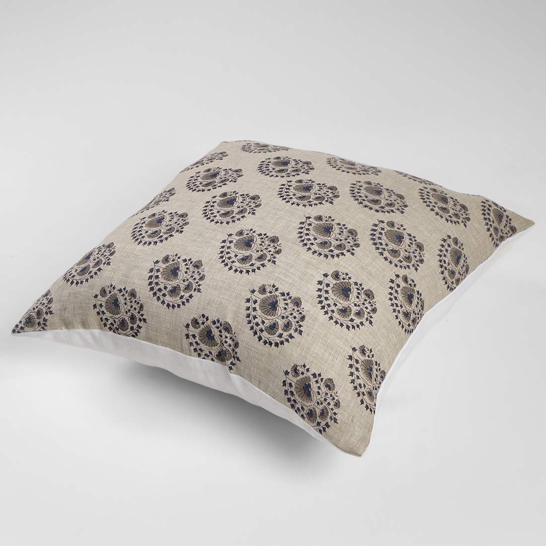 Decorative pillow with a floral pattern on a white background