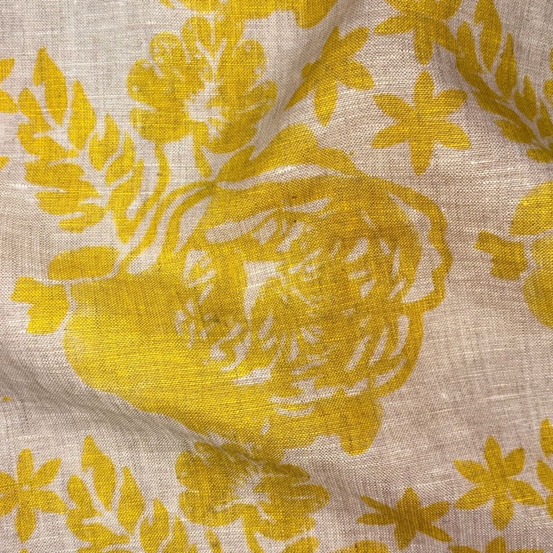 Close-up of yellow floral pattern on grey fabric