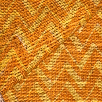 Patterned fabric with orange and yellow chevron design
