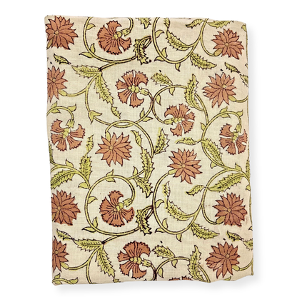 Floral patterned fabric with red flowers and green leaves on a beige background