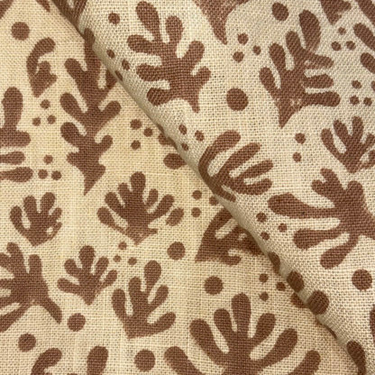 Fabric with brown leaf pattern on beige background