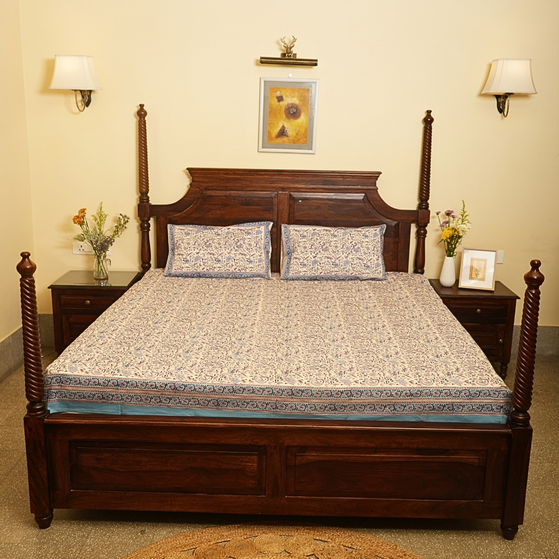 Wooden bed with floral bedding in a bedroom setting