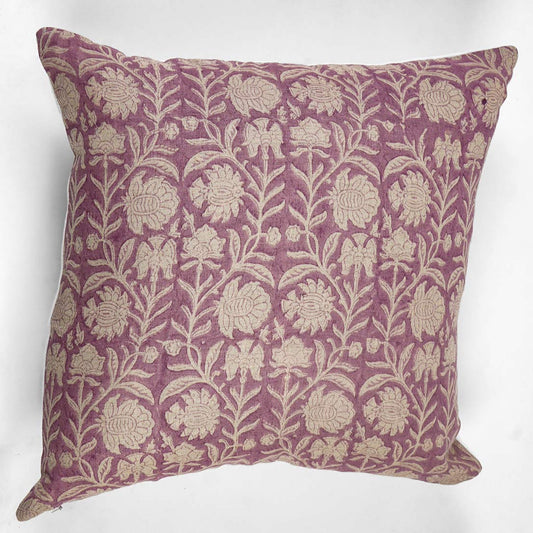 Decorative pillow with floral pattern on a pink background