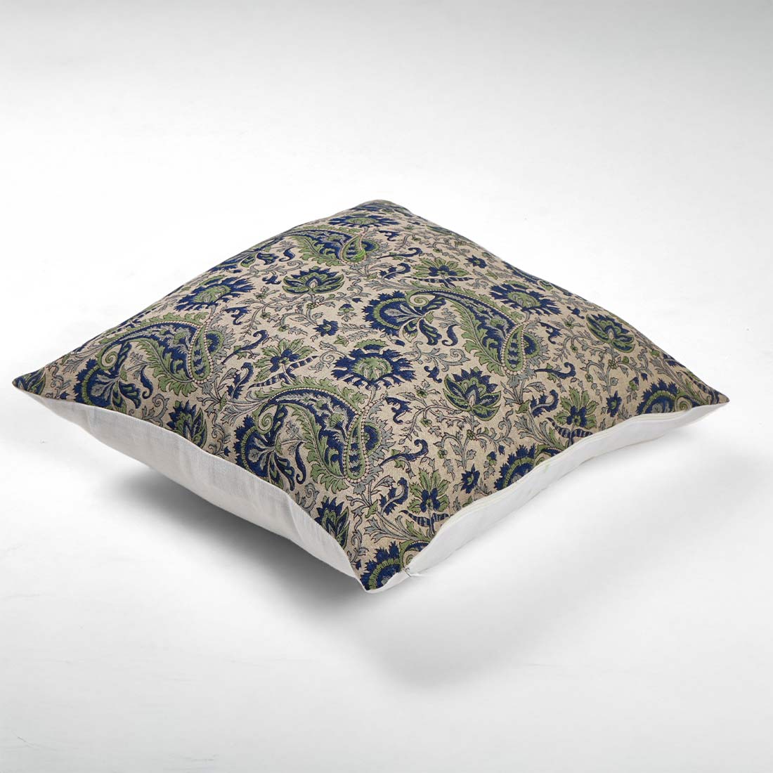 Decorative pillow with paisley pattern on a white background