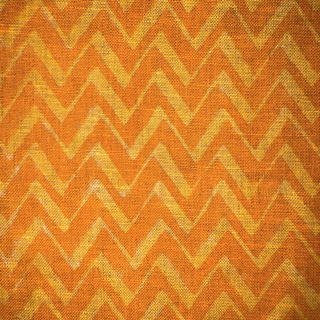 Fabric with orange and yellow chevron pattern