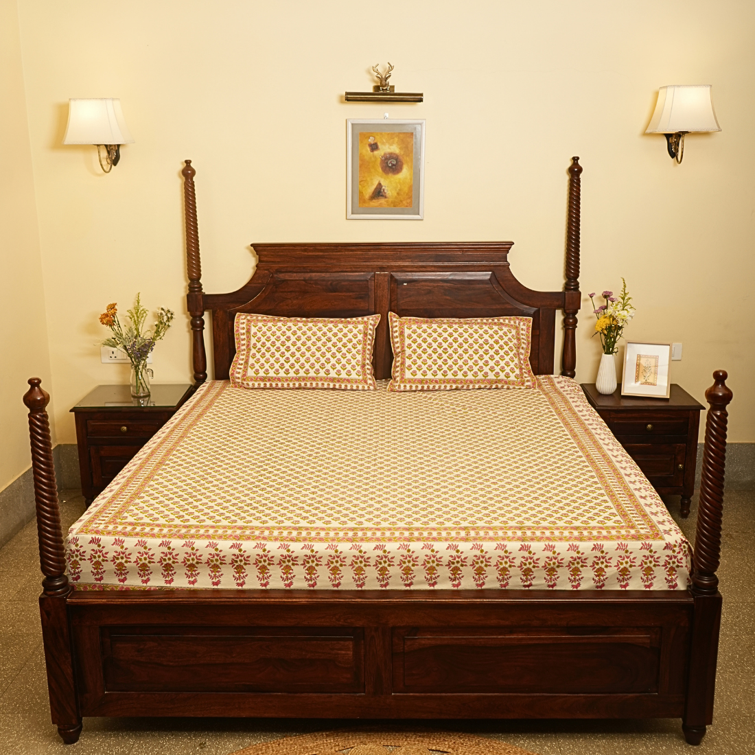 Wooden bed with floral bedding in a bedroom setting