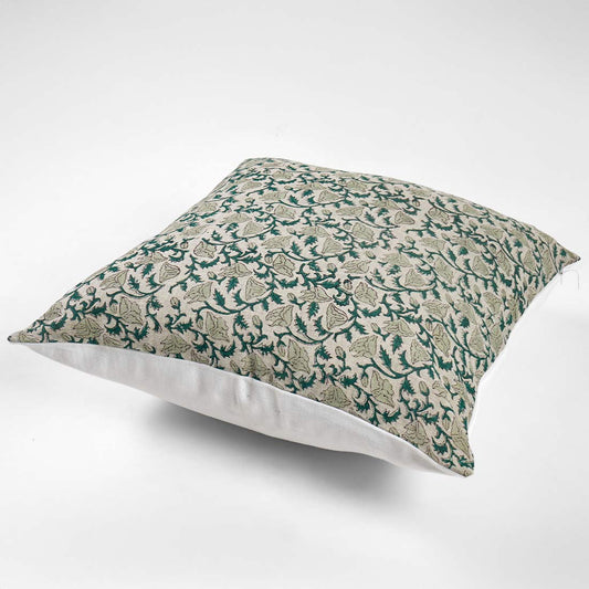 Decorative pillow with green floral pattern on a white background