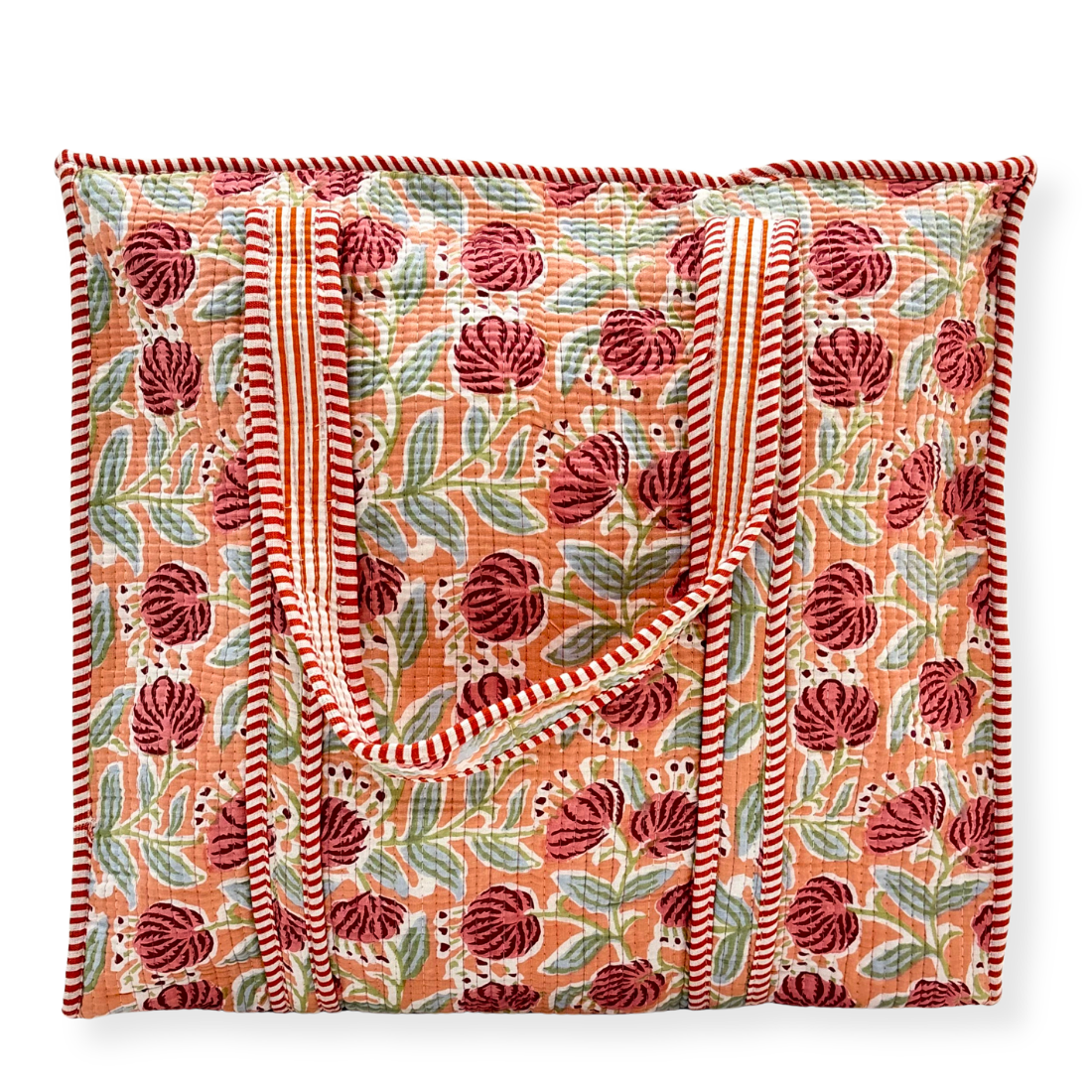 Floral patterned tote bag with red and green design on a white background