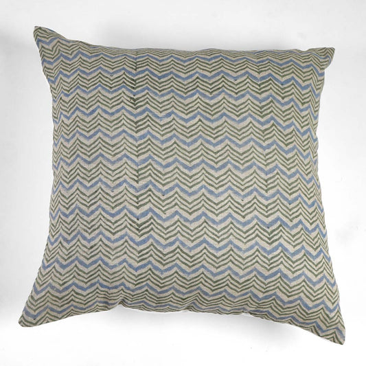 Decorative pillow with zigzag pattern on a white background