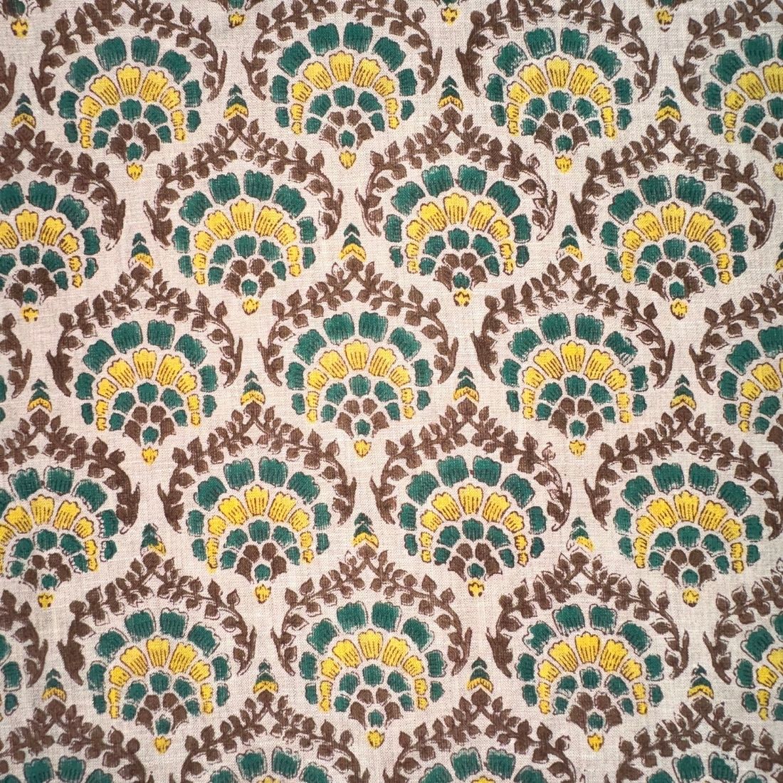 Patterned fabric with green, yellow, and brown colors on a grey background