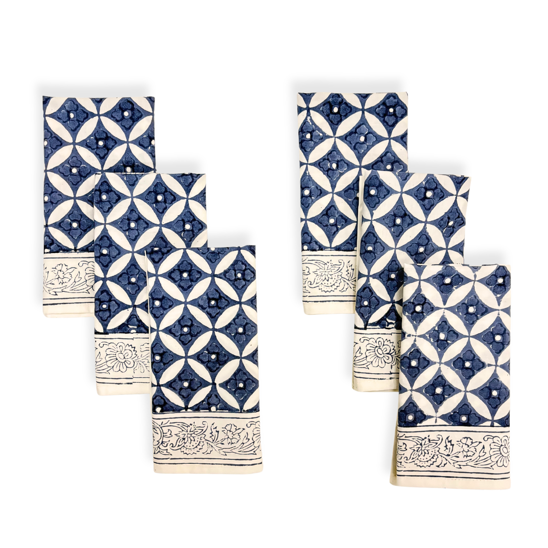 Set of six blue and white patterned napkins on a white background