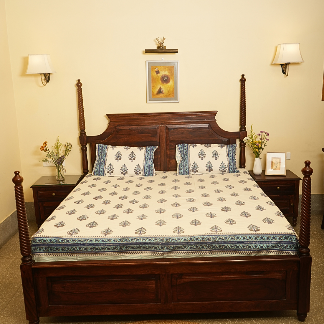 Wooden bed with floral bedding in a bedroom setting