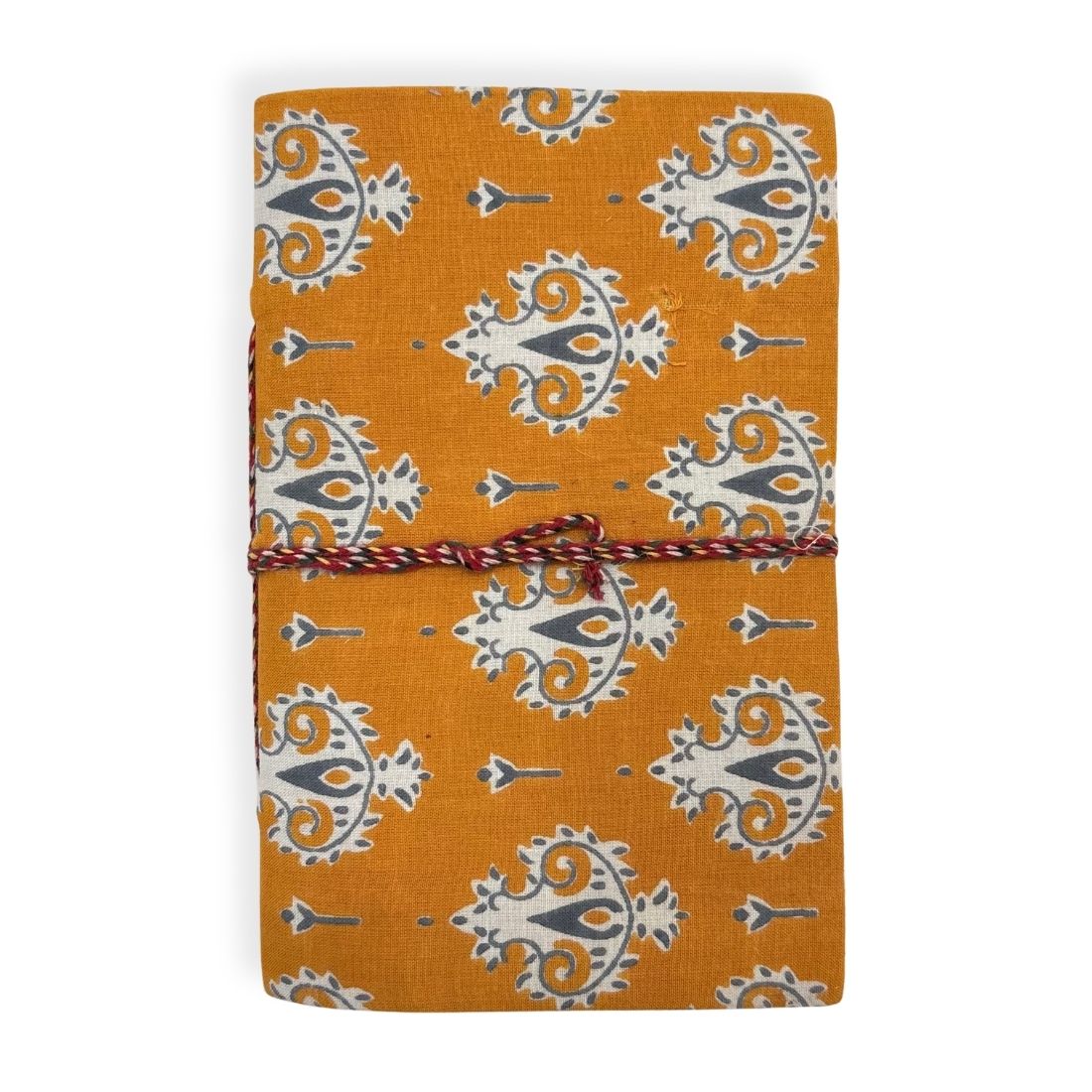 Orange notebook with white patterns and a red string on a white background.