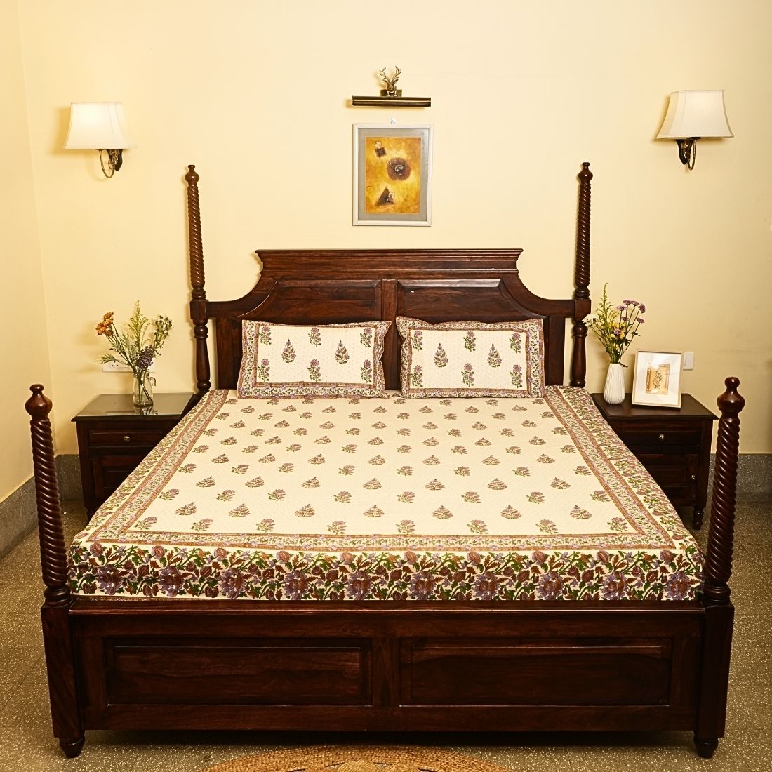 Wooden bed with floral bedding in a bedroom setting