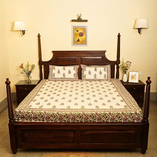 Wooden bed with floral bedding in a bedroom setting