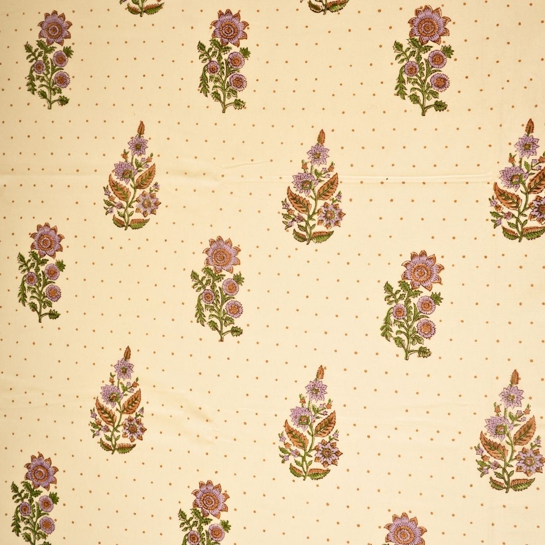 Floral pattern on a beige background with small dots