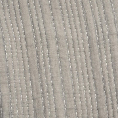 Close-up of textured gray throw with subtle pattern