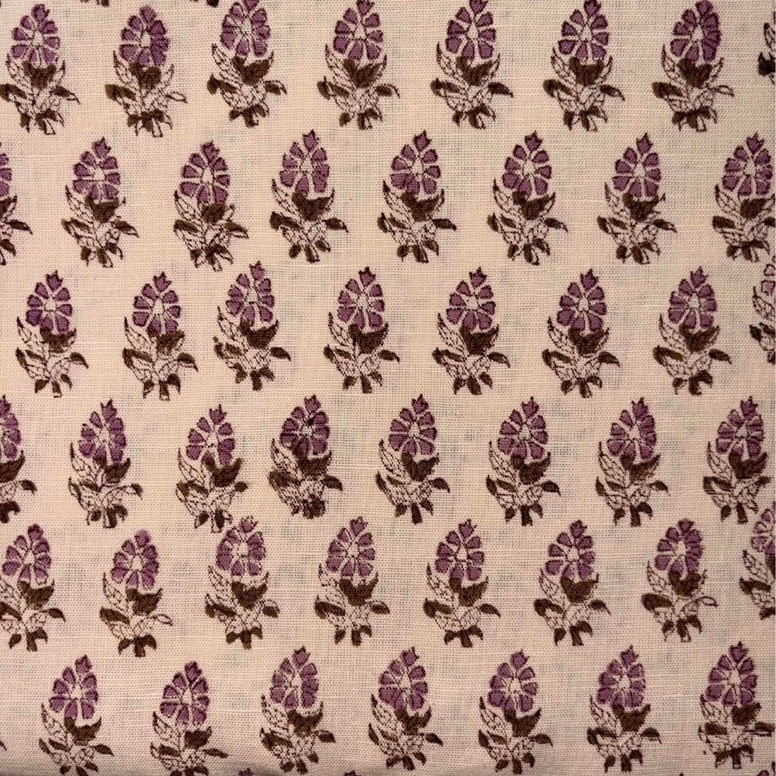 Patterned fabric with pink and brown floral design on a beige background