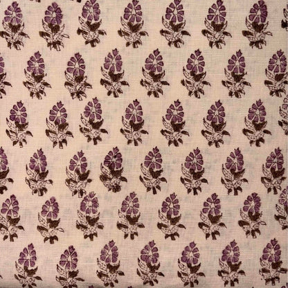 Patterned fabric with pink and brown floral design on a beige background