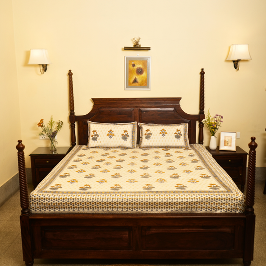 Wooden bed with floral patterns in a bedroom setting