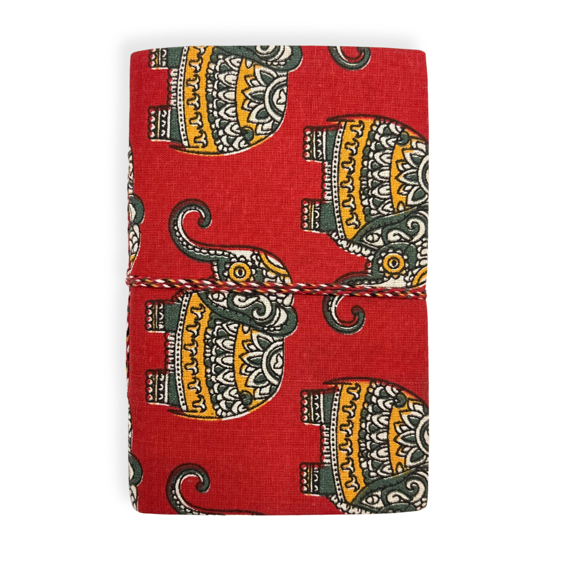 Red notebook with elephant pattern on a white background
