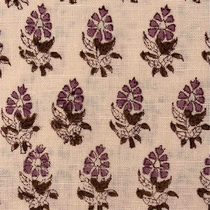Patterned fabric with pink and brown floral design on a beige background