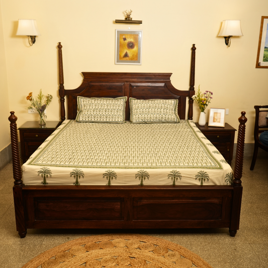 Bedroom with a wooden bed, nightstands, and decorative items.