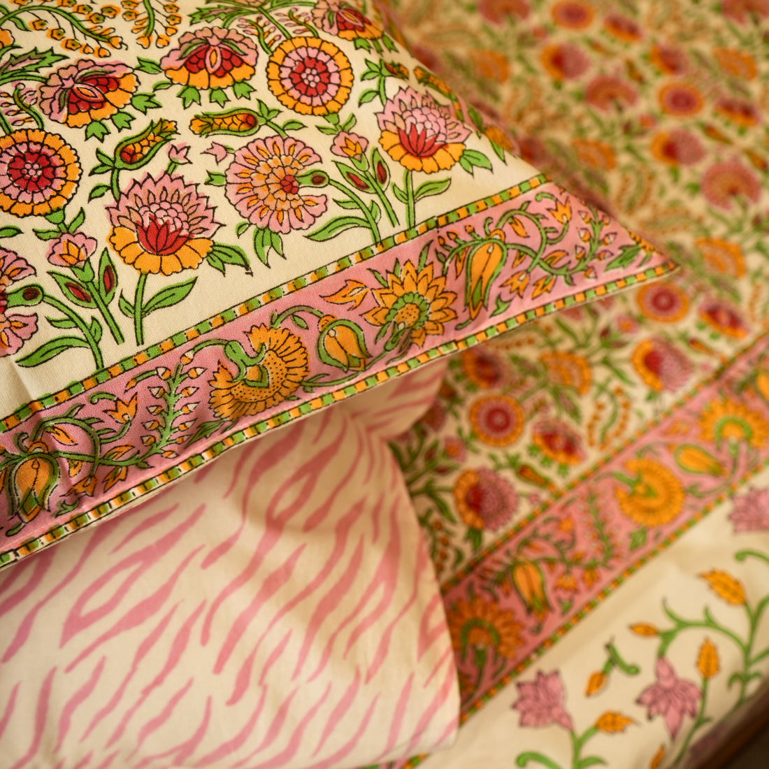 Floral patterned fabric with pink and green accents