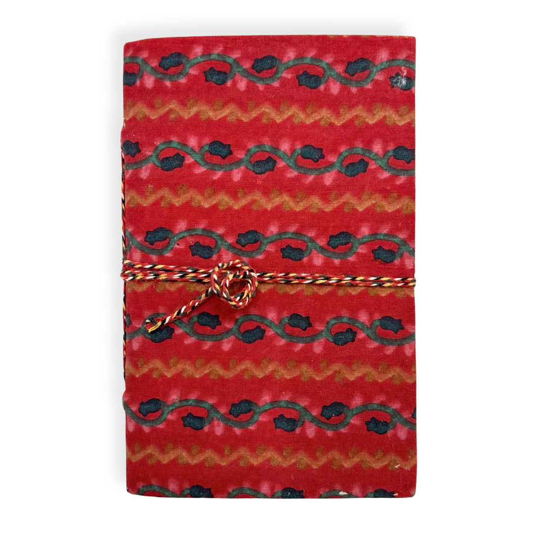 Red notebook with black and gold pattern tied with a string on a white background
