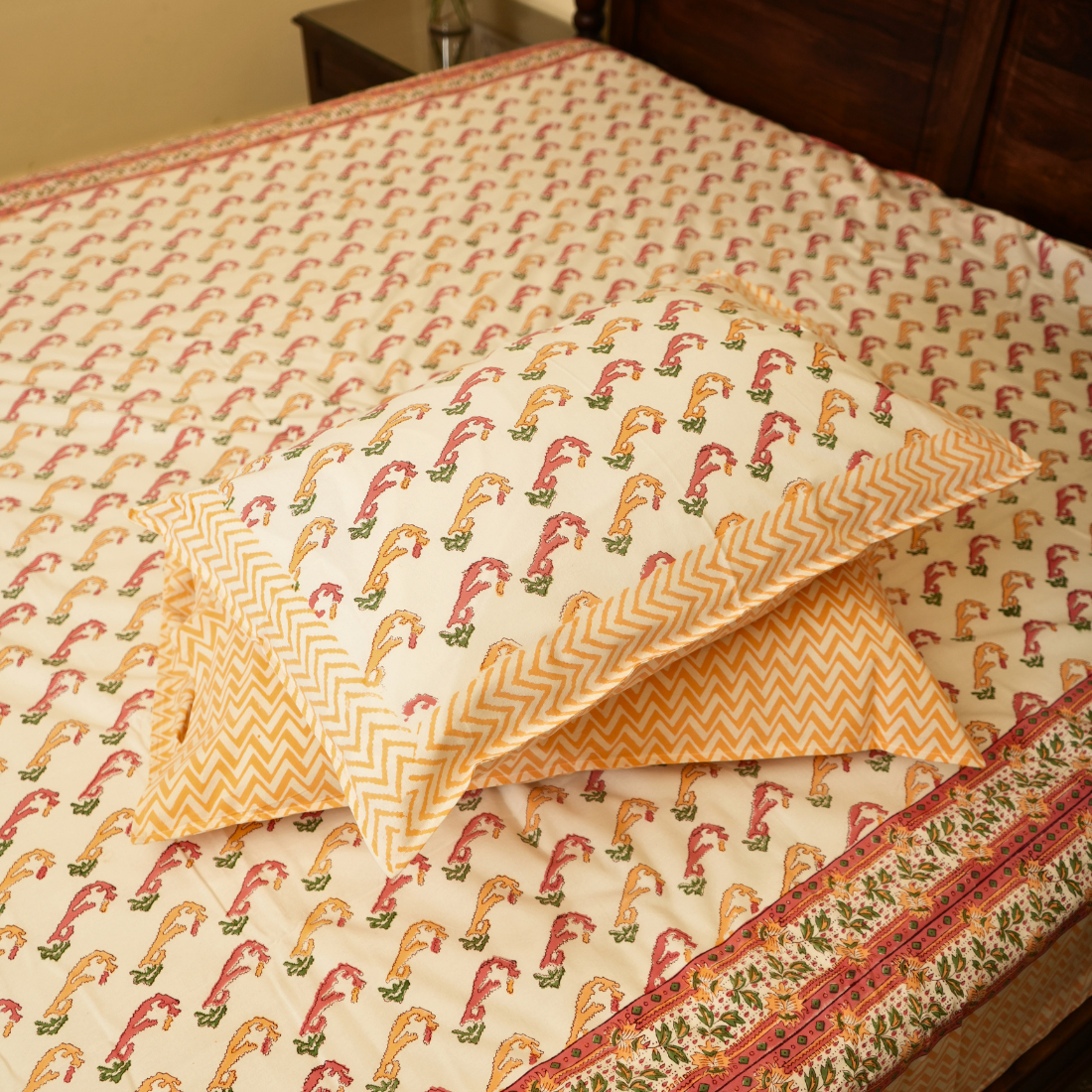 Patterned fabric with a chevron design on a bed