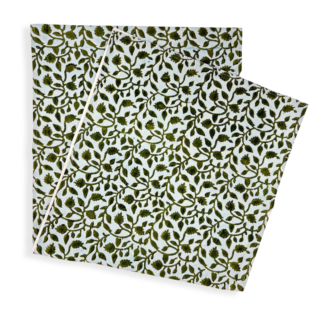 Table runner with green leaf pattern on white background.