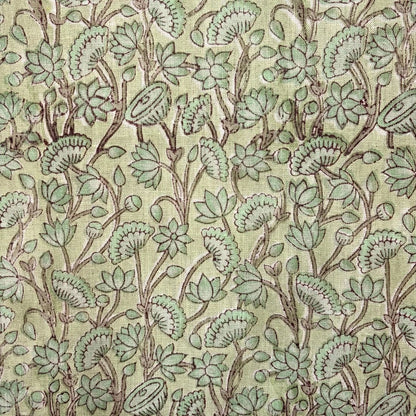 Patterned fabric with green leaves and branches on a grey background