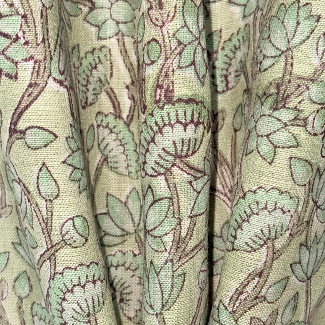 Close-up of fabric with a floral pattern on a grey background