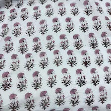 White fabric with a repeating pattern of small purple flowers and dark green leaves.