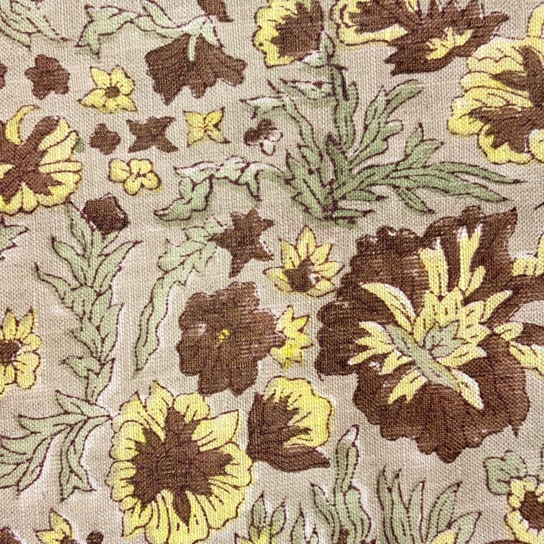 Floral pattern with brown and yellow flowers on a grey background