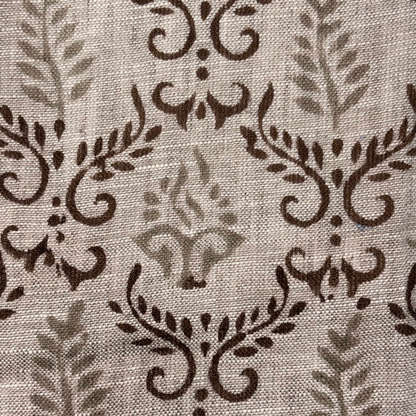 Close-up of fabric with brown floral pattern on grey background