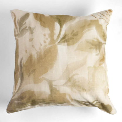 Decorative pillow with a beige and brown abstract pattern on a white background