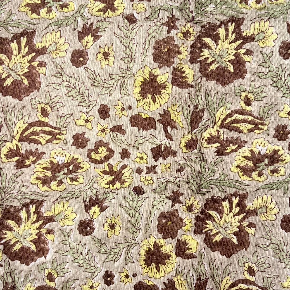 Floral pattern with brown and yellow flowers on a grey background
