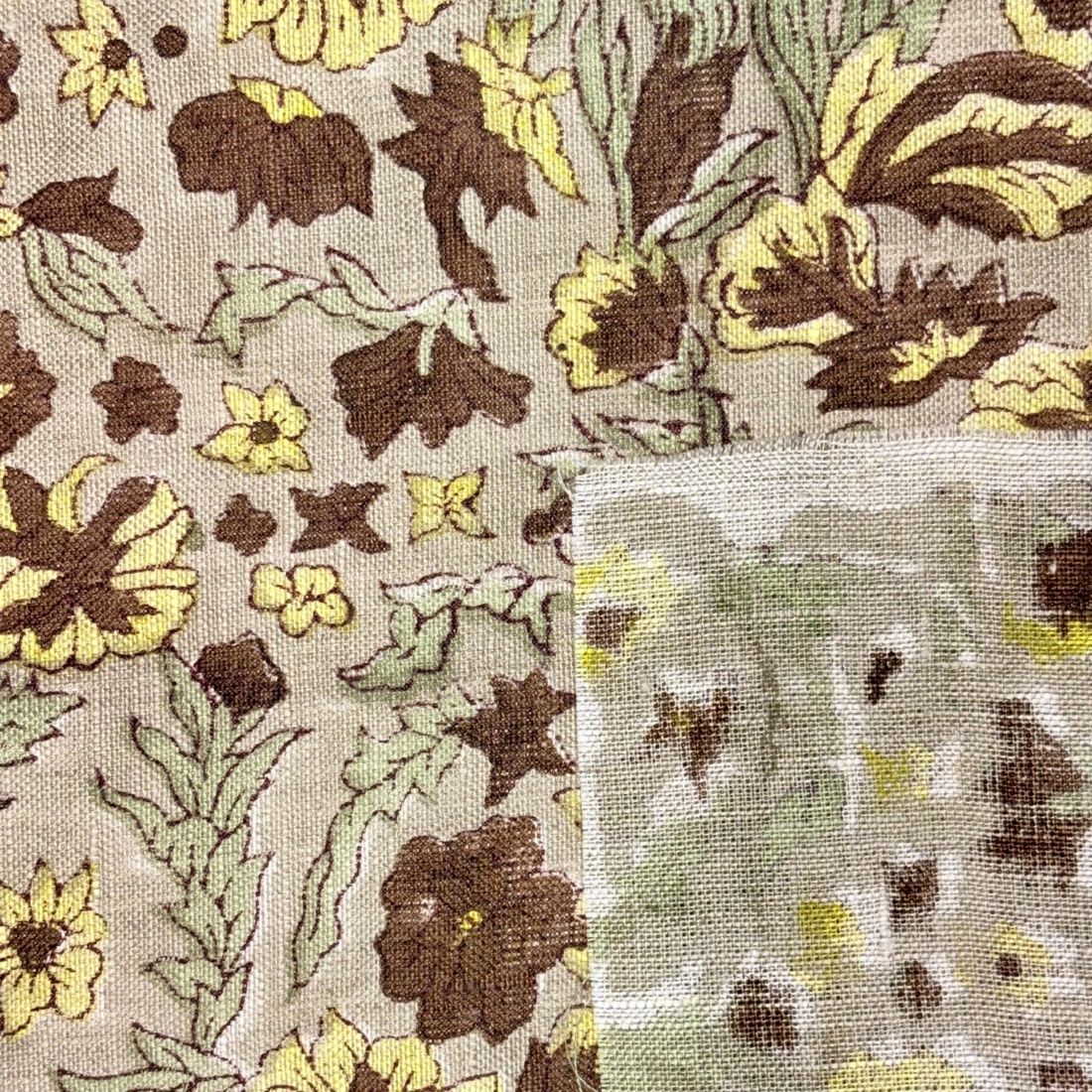 Floral patterned fabric with brown, yellow, and green colors.