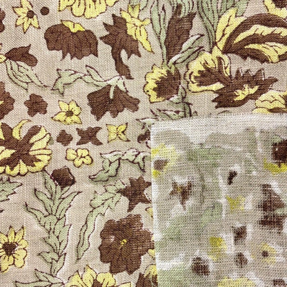 Floral patterned fabric with brown, yellow, and green colors.