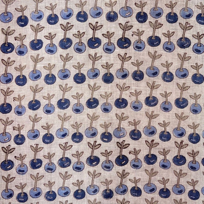 Pattern of blue berries with stems on a grey background