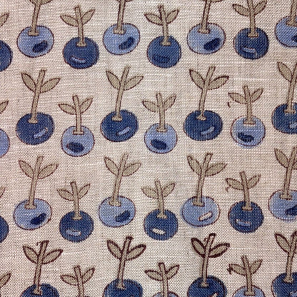 Pattern of blue berries with stems on a grey background